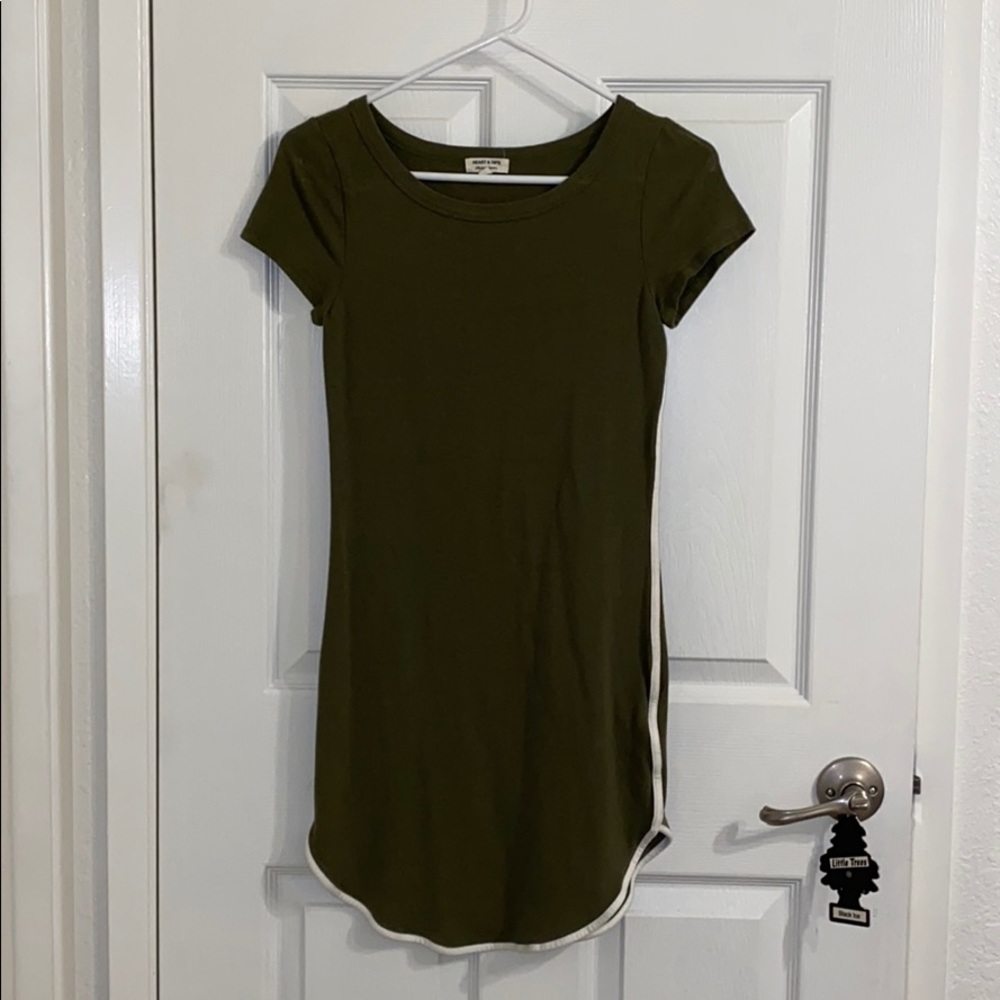 A green dress with white on the sides
